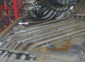Field bending of hydraulic lines lower pressure drop and lower maintenance