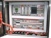 View of control panel showing PLC and terminal strip layout. Compact design, easy to maintain.